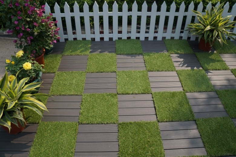interlocking outdoor tiles over grass